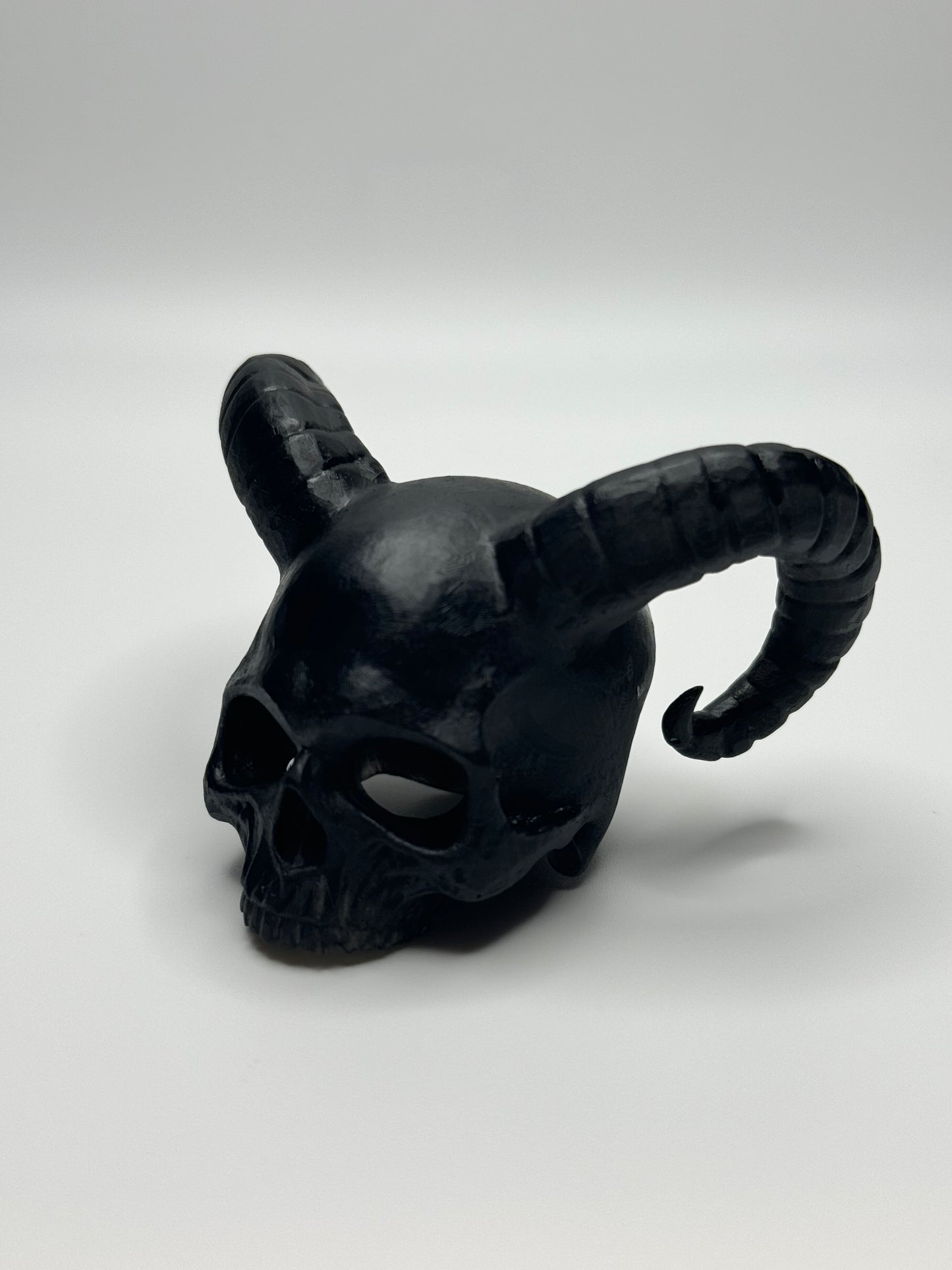 Unique demon skull dice jail, perfect for tabletop gamers looking to punish their rogue dice during Dungeons & Dragons or other RPG sessions.