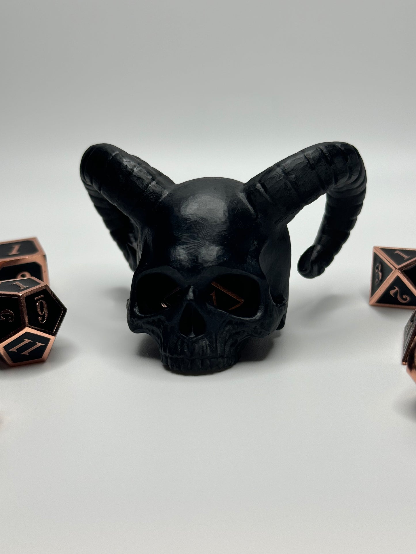 Unique demon skull dice jail, perfect for tabletop gamers looking to punish their rogue dice during Dungeons & Dragons or other RPG sessions.