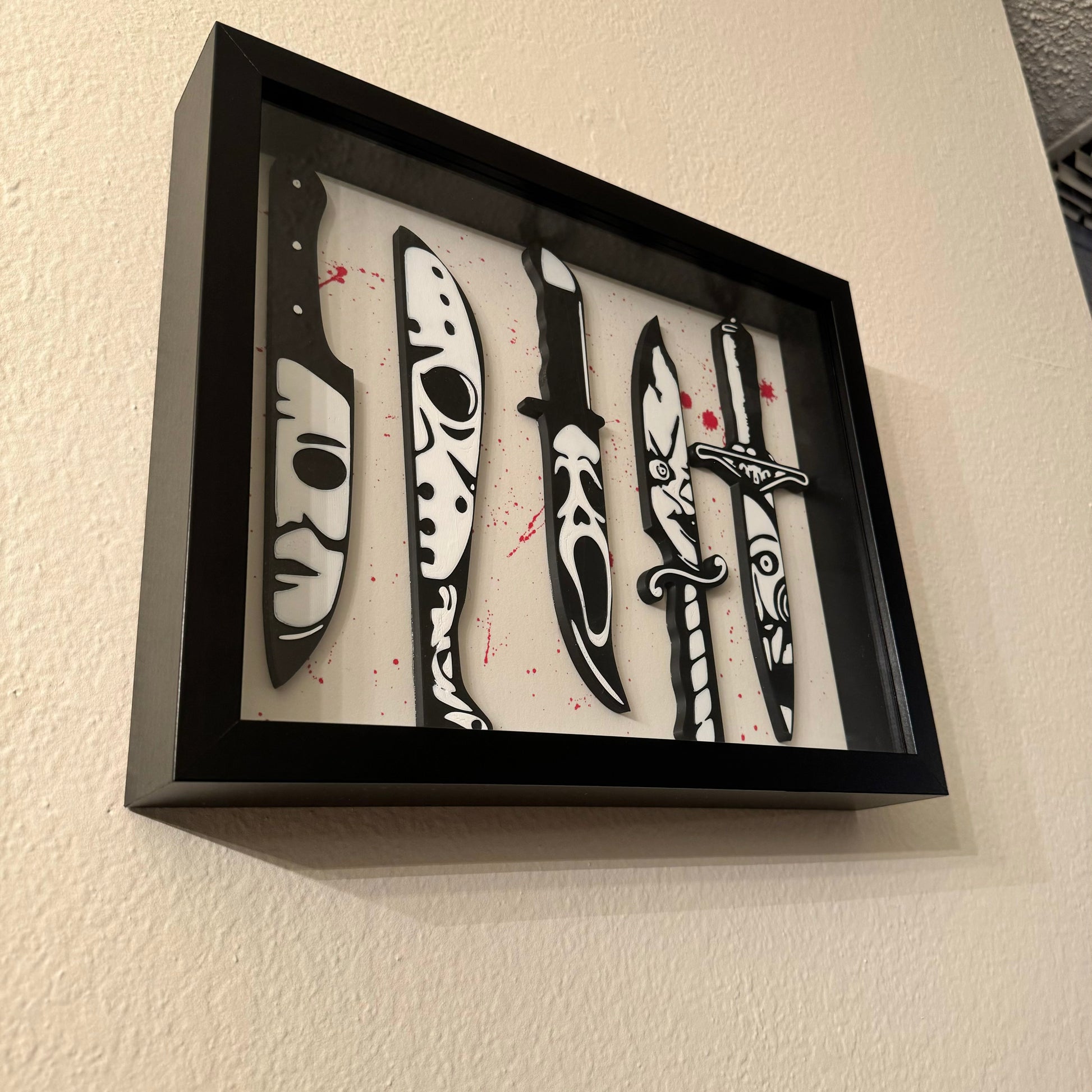 Handcrafted horror movie shadow box featuring iconic film scenes.